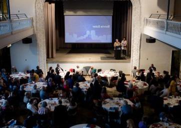 2022 Scholarship Celebration inside the Tivoli Turnhalle with people sitting around tables